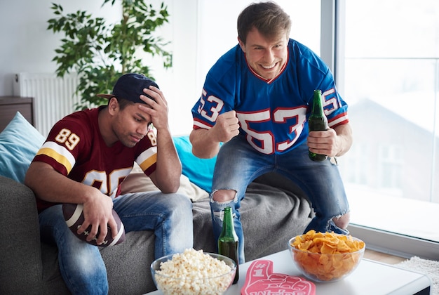 Photo guys supporting two different teams