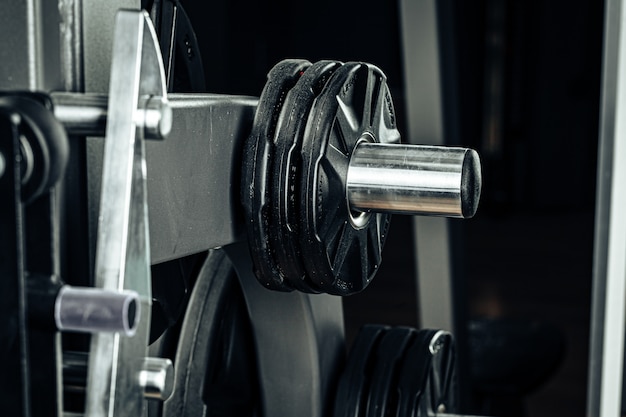 Photo gym weight plates on holder close up