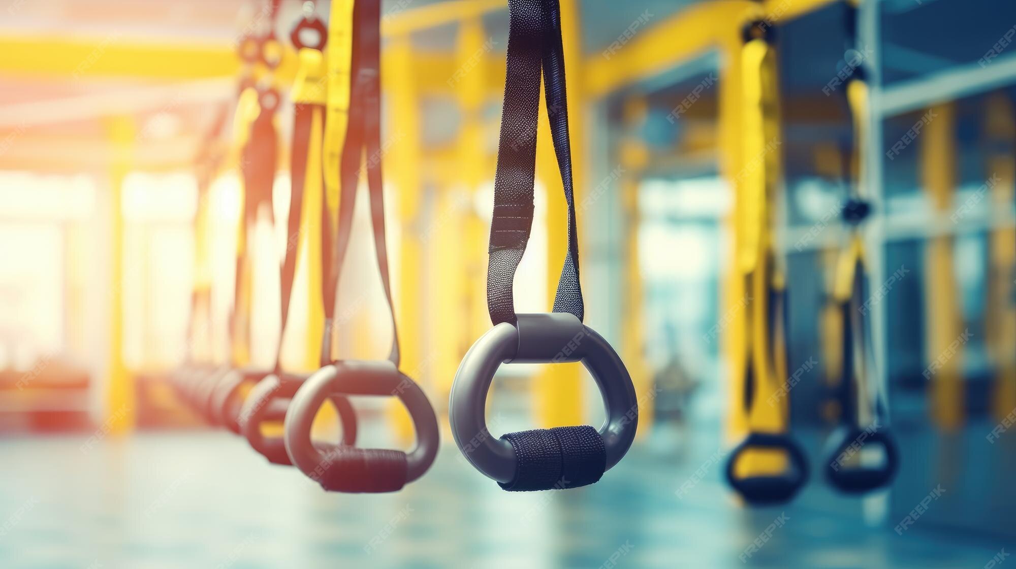 premium-ai-image-a-gym-with-a-black-gym-belt-hanging-from-the-ceiling