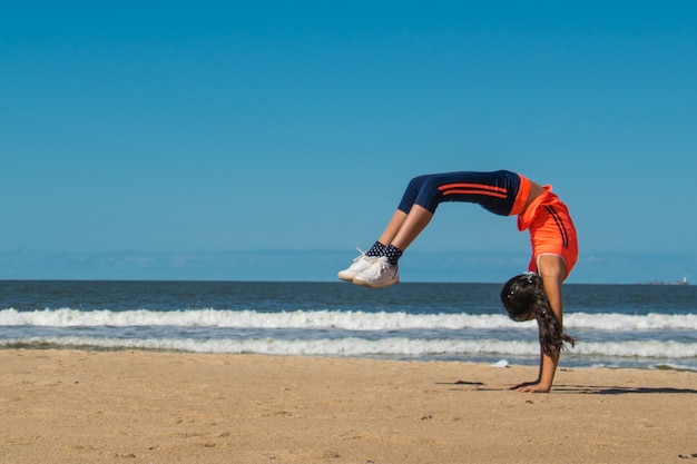 gymnast on the beach