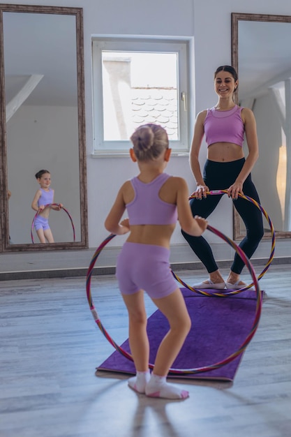gymnast child performs an exercise with hoopchildrens professional sports