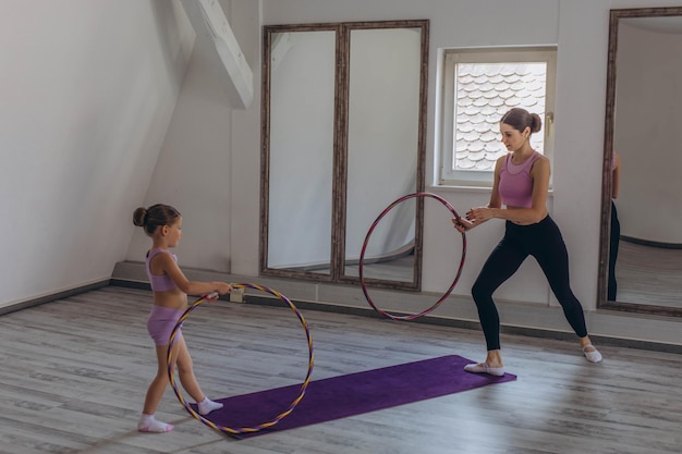gymnast child performs an exercise with hoopchildrens professional sports