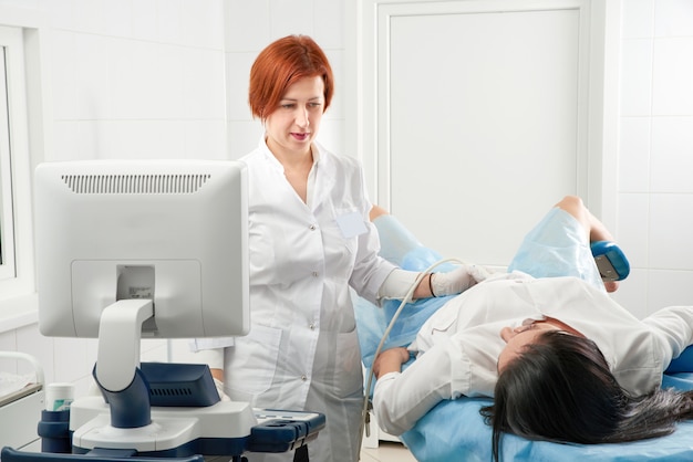 Gynecologist doing ultrasound scanning