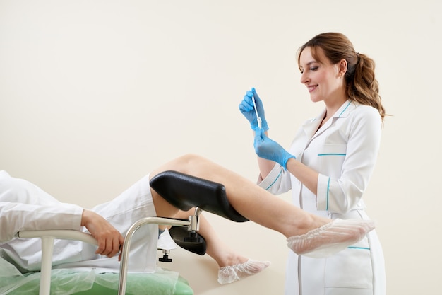 Gynecologist using vaginal swab for STD testing