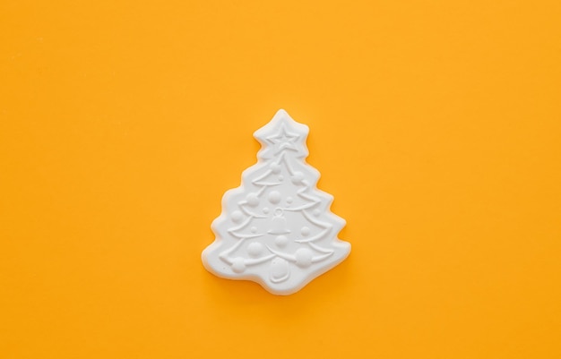Gypsum figure of a Christmas tree on a colored background