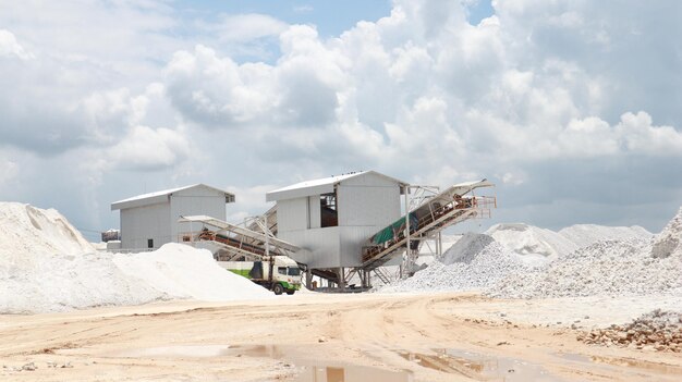 Gypsum grist mill in gypsum mining industry area with blue sky and white could background semi precious white gem deposit or mining grist mill