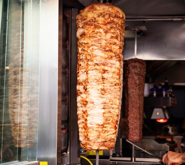 Gyro or doner roasted slowly on rotating spit Close up view