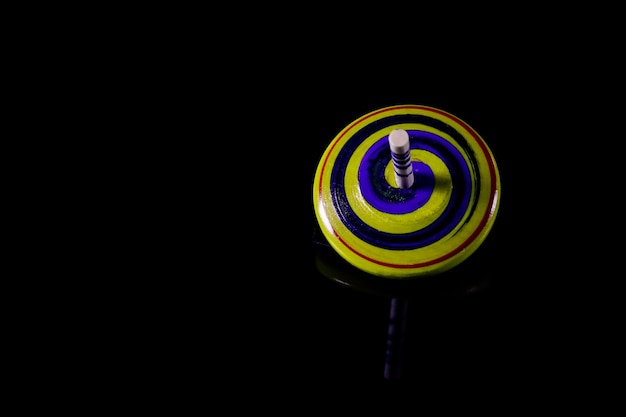 Gyroscopes toy on black background.