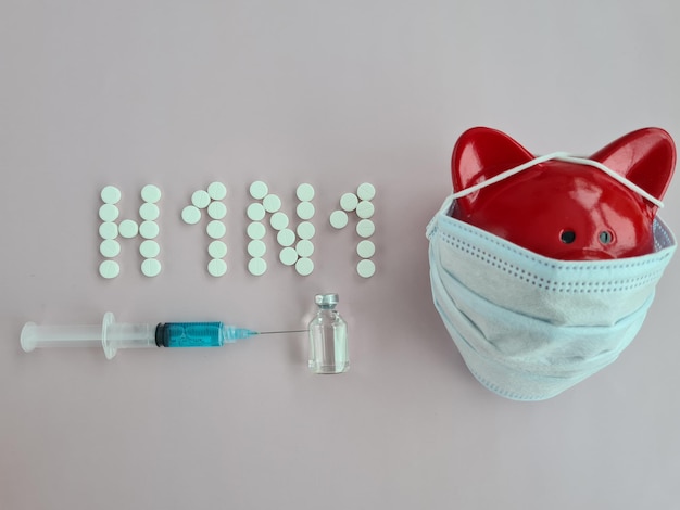 H1N1 flu vaccine and syringe in patient immunization