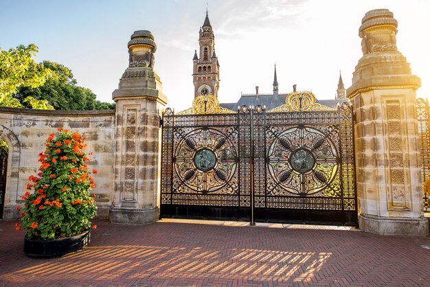 HAAG, NETHERLANDS - August 06, 2017: View on the gate of Peace Palace during the sunset, international law administrative building in Haag city.