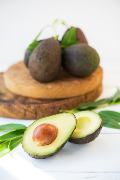 Haas avocado on a wooden board, natural products, selective focus