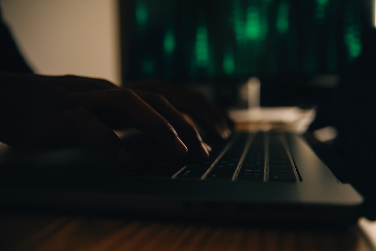 Photo hacker code in laptop cyber security privacy or hack threat coder or programmer writing virus software malware internet attack or developing digital design green web data in computer screen
