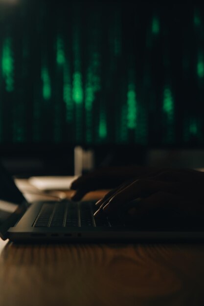 hacker code in laptop cyber security privacy or hack threat coder or programmer writing virus software malware internet attack or developing digital design green web data in computer screen