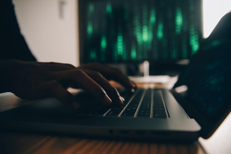 Photo hacker code in laptop cyber security privacy or hack threat coder or programmer writing virus software malware internet attack or developing digital design green web data in computer screen