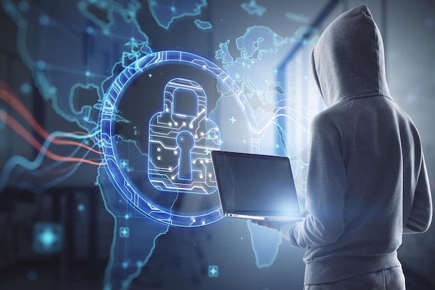 Hacker in hoodie using laptop computer with abstract digital\
padlock and map hologram on blurry office interior background\
hacking security and global protection concept double exposure