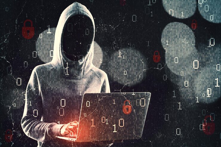 Photo hacker in hoodie using laptop while standing on abstract dark hacking background with bokeh circles and binary coding malware and phishing data theft concept