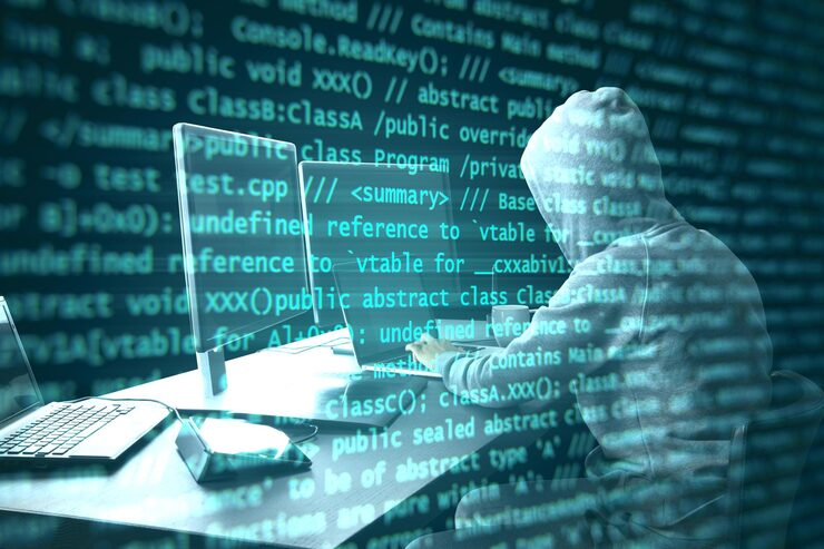 Photo hacker programmer using computer with abstract programming code