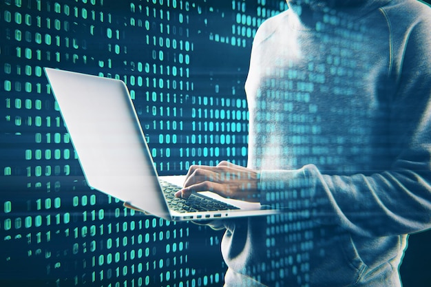 Hacker using laptop with creative digital binary code dots hologram Digital data hacking concept Double exposure