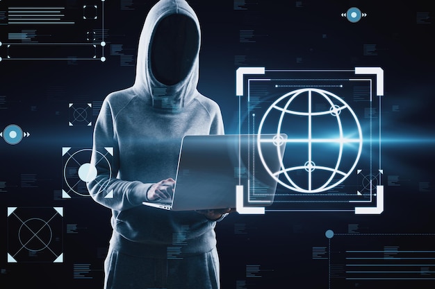 Hacker using laptop with creative hacking interface on dark background Code window high tech UI and spyware concept