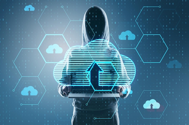 hacker using laptop with glowing hexagonal cloud computing hologram with binary coding on blurry backdrop safety hacking malware and internet concept double exposure