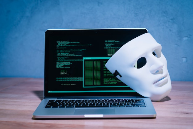 Hackers mask and laptop