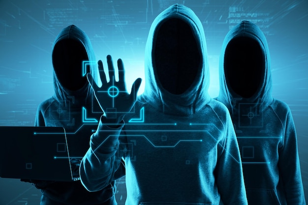 Photo hacking attack and internet security concept with faceless hackers in hoody using laptop and touching virtual screen with identification button on blue background