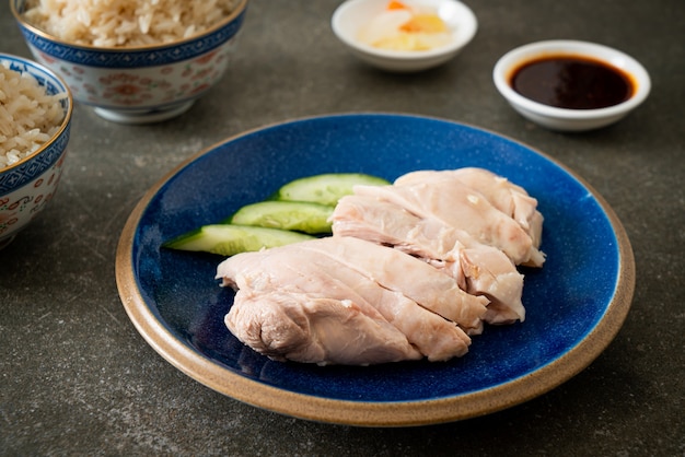 Hainanese chicken rice or rice steamed with chicken soup - Asian food style