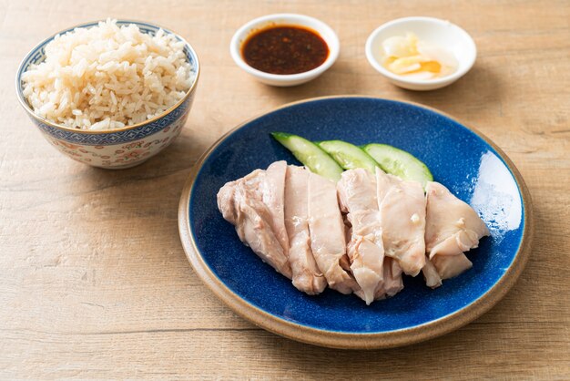 Hainanese chicken rice or rice steamed with chicken soup - Asian food style