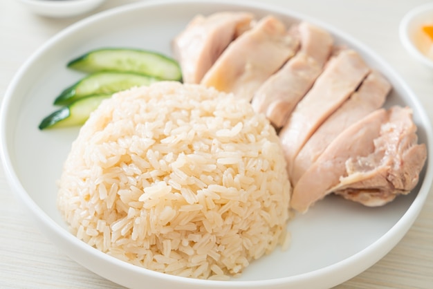 Hainanese chicken rice or rice steamed with chicken soup - Asian food style