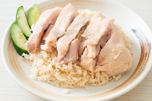 Hainanese chicken rice or rice steamed with chicken soup - Asian food style