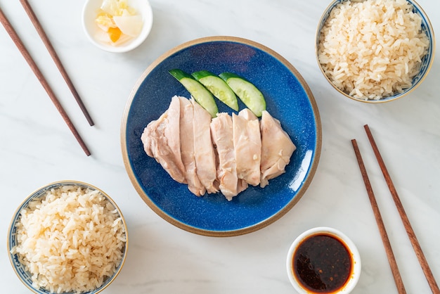 Hainanese chicken rice or rice steamed with chicken soup - Asian food style