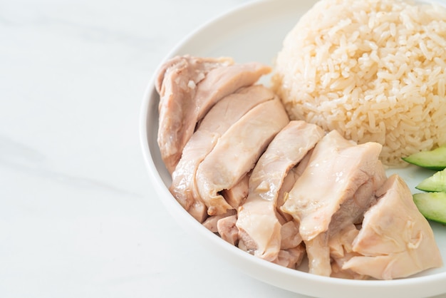 Hainanese chicken rice or rice steamed with chicken soup - Asian food style