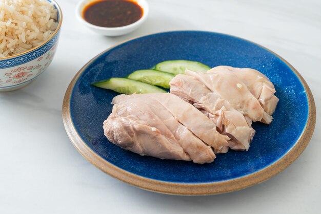 Hainanese chicken rice or rice steamed with chicken soup - Asian food style