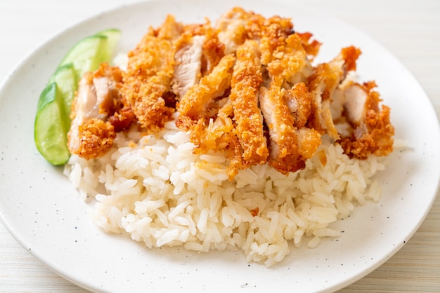 Premium Photo | Hainanese chicken rice with fried chicken or rice ...