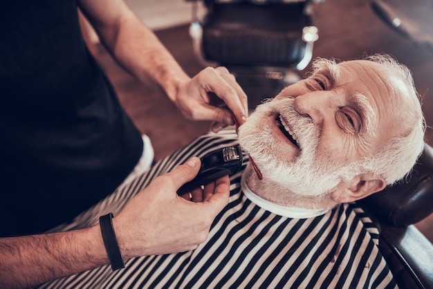 Hair Brush in Hands Young Man in Barbershop