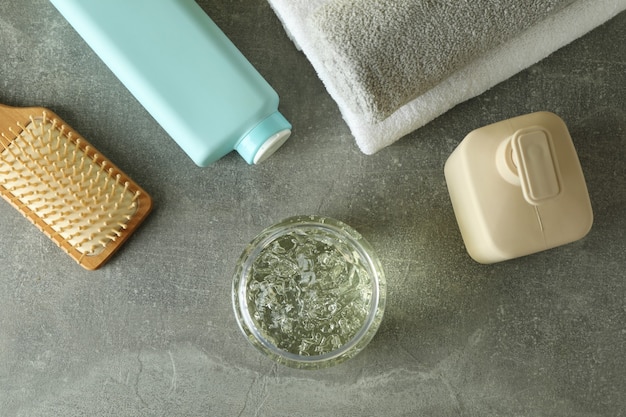 Hair care accessories on gray textured table