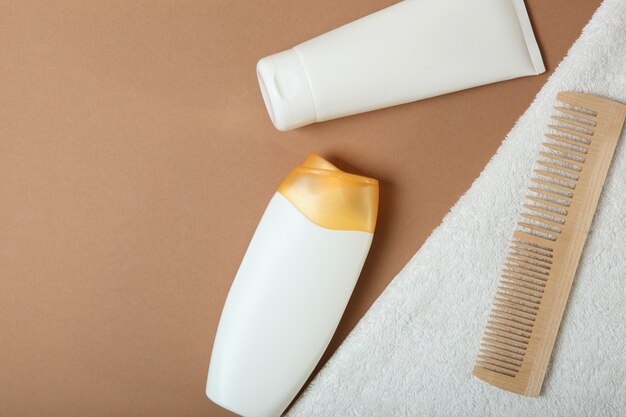 Hair care products and comb on the table top view