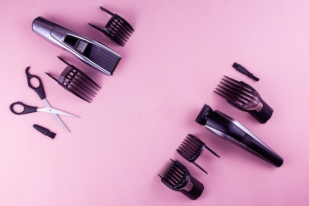 Photo hair clipper pink background.