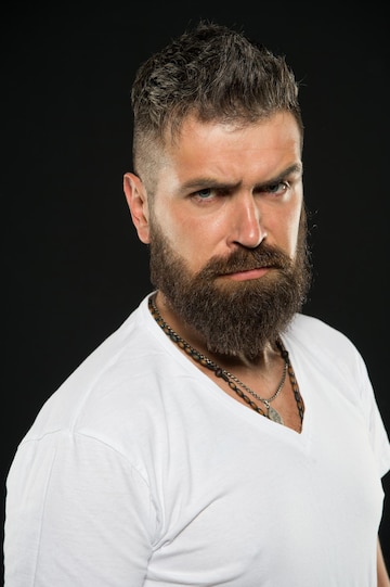 Premium Photo | Hair design trends. serious hipster with long beard and stylish hair on black background. bearded man with unshaven face hair. brutal guy with shaped beard and mustache hair. Premium Photo | Hair design trends. serious hipster with long beard and stylish hair on black background. bearded man with unshaven face hair. brutal guy with shaped beard and mustache hair.