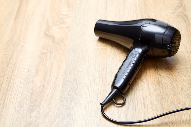 Hair dryer on wooden