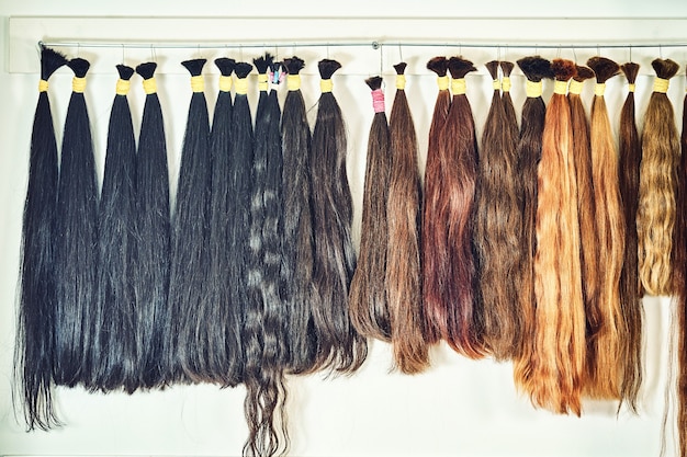 Hair extension equipment of natural hair. hair samples of different colors