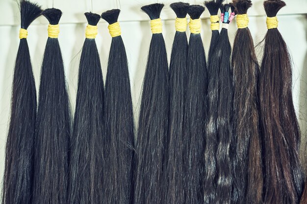 Hair extension equipment of natural hair. hair samples of different colors