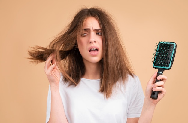 Hair loss woman with a comb and problem hair Hairloss and bald problems concept
