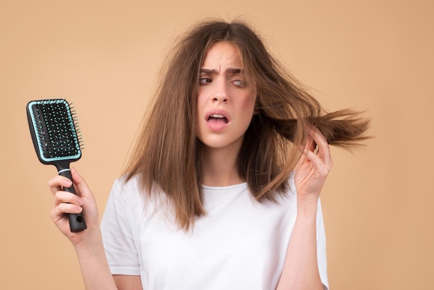 Photo hair loss woman with a comb and problem hair hairloss and bald problems concept