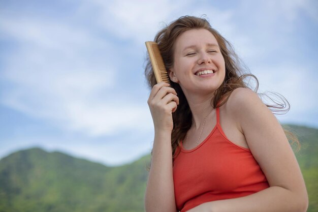 Hair loss young girl with a comb and problem hair Hairloss stressed woman and bald problems