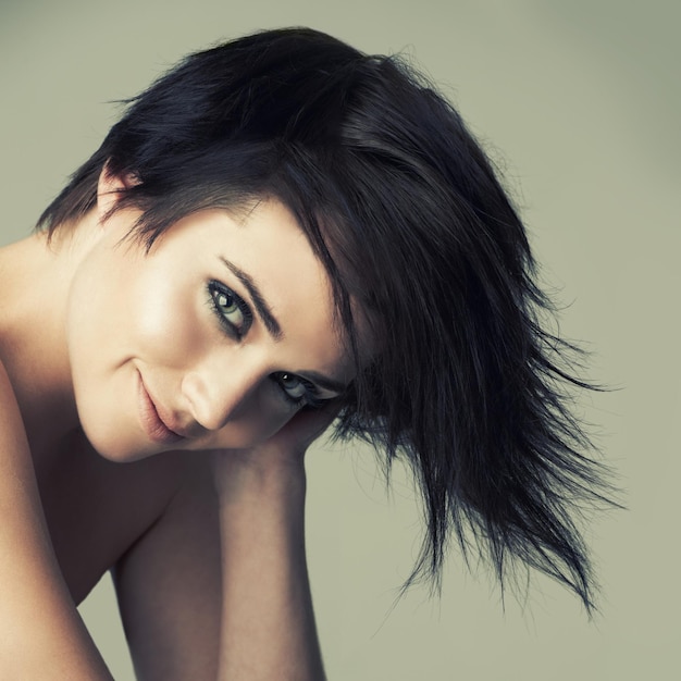 Hair portrait and woman in studio with shampoo treatment or haircut results on wall background Haircare face and emo female model smile for dye color or cosmetics punk rocker or goth aesthetic