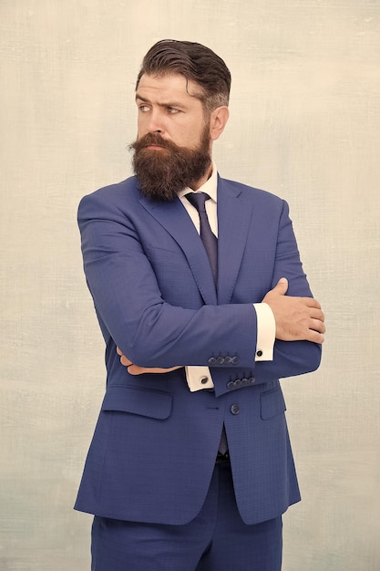 Hair salon and barbershop Business casual style Giving man confidence Senior employee blue suit Brutal bearded man in blue formalwear Businessman has long beard great opportunity to succeed