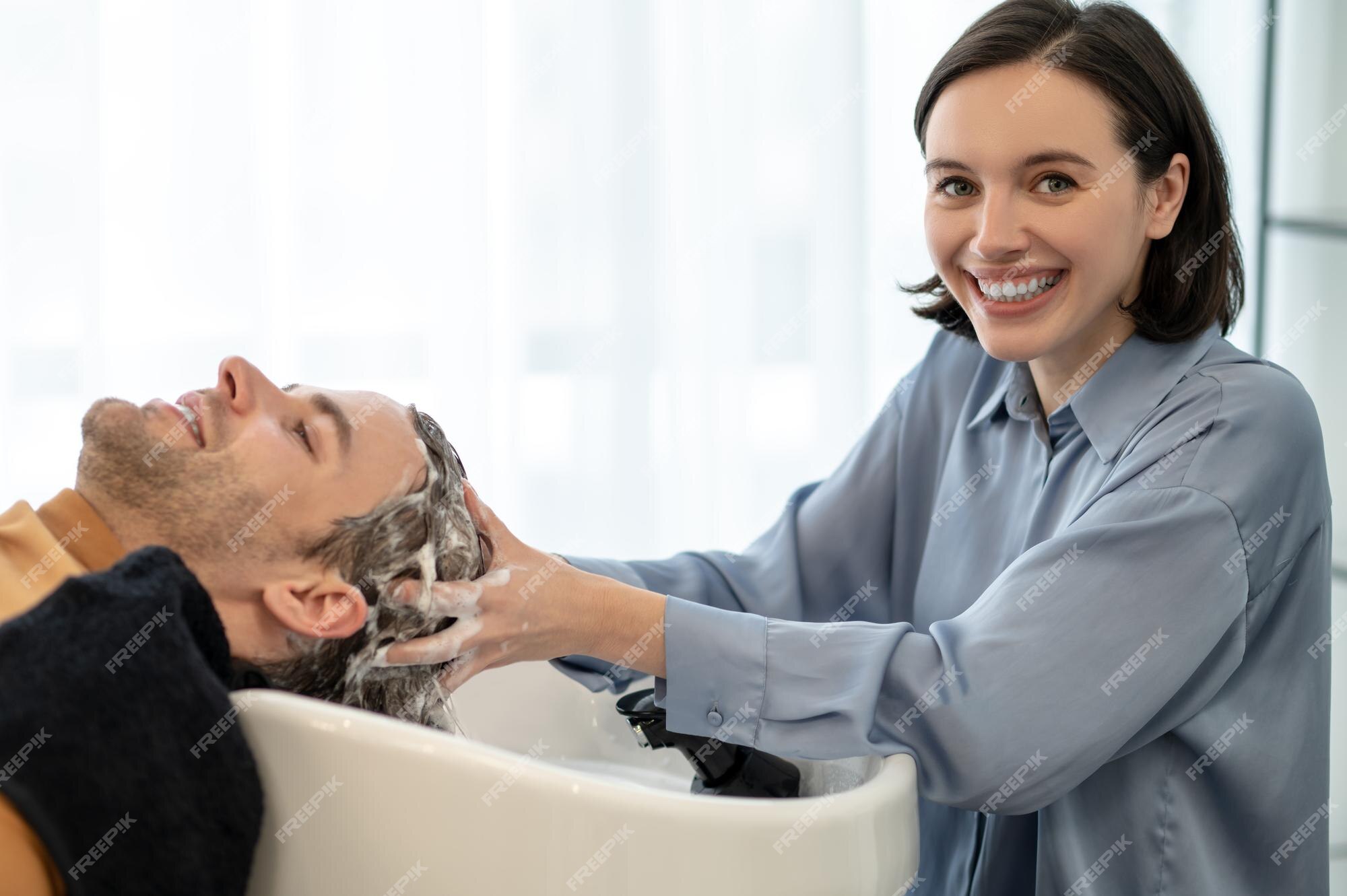Premium Photo | Hair wash. male customer sitting at the chair in the beauty salon and having his hair washed Premium Photo | Hair wash. male customer sitting at the chair in the beauty salon and having his hair washed