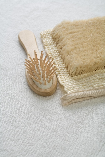 Hairbrush and bast on white background