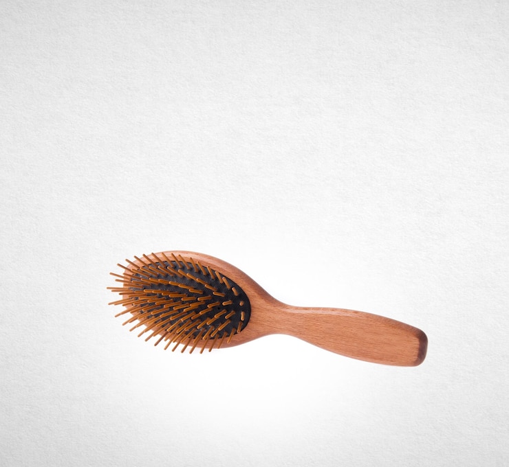 Photo hairbrush over white background